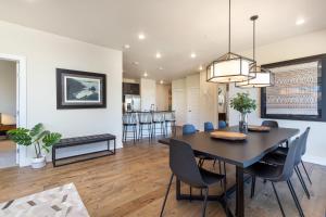 a dining room and living room with a table and chairs at Sail Lofts #301 in Dillon