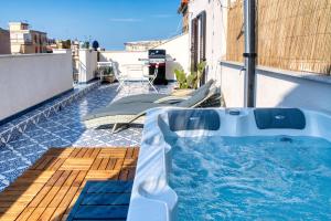 a hot tub on the side of a building at Zisa Top Romantic Terrace & Private outdoor Jacuzzi in Palermo