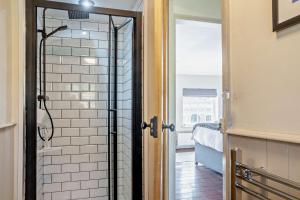 a bathroom with a shower with a glass door at 2 Bed in Cherry Burton oc-c37535 in Cherry Burton +17 photos