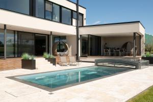 an image of a house with a swimming pool at Eifelvilla Weber in Arenrath