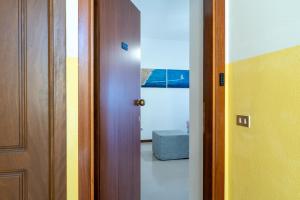 a hallway with a door and a room with a window at Altea in Fossacesia
