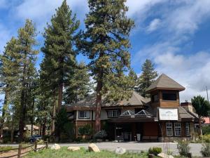a large house with trees in front of it at HiMark Hotel in South Lake Tahoe