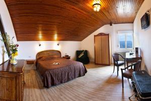 Postel nebo postele na pokoji v ubytování Auberge Obersolberg