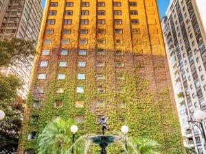 a tall building with ivy on the side of it at Sofitel Buenos Aires Recoleta in Buenos Aires