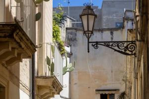 a street light on the side of a building at Il rifugio barocco in Lecce
