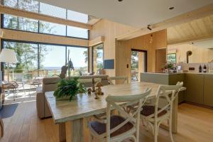 a kitchen and dining room with a wooden table and chairs at Le Chalet Cormoyeux in Cormoyeux