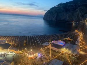 an aerial view of a beach at night with lights at The Lemon Garden Escape in Meta