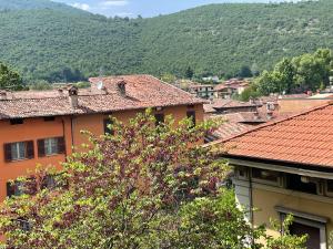 a group of houses in a town with mountains in the background at Lake Garda in Gavardo