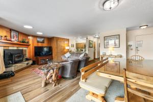 a living room with a couch and a television at Pines #2071 : 2 in Keystone