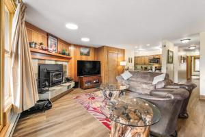 a living room with a couch and a table at Pines #2071 : 2 in Keystone