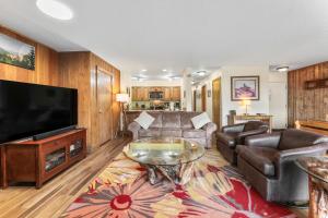 a living room with a couch and a television at Pines #2071 : 2 in Keystone