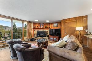 a living room with a couch and a fireplace at Pines #2071 : 2 in Keystone