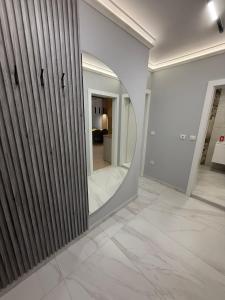 a mirror on a wall in a room at RICH 2 Apartment in Plovdiv