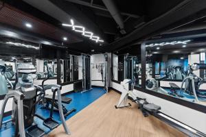 a gym with treadmills and elliptical machines at Silver Mill #8274 in Keystone