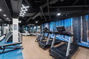 a gym with treadmills and ellipticals in front of a wall at Silver Mill #8274 in Keystone +37 photos