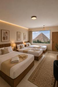 a hotel room with two beds and a pyramid at Vincci Pyramids View in Cairo