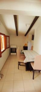a room with a table and chairs in a room at Oasis - Oaza in Sutomore