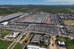 an aerial view of a parking lot with cars at Moda Center Hotel in Santa Cruz do Capibaribe