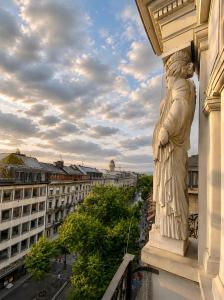 a statue of a woman on the side of a building at The Crown Penthouse Bahnhofstrasse in Zurich