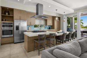 a kitchen with a large island with a counter top at Second Wind Villa in Long Bay Hills