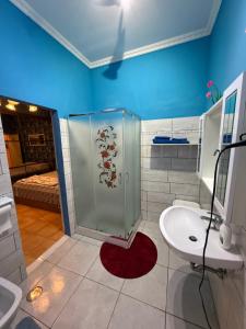 a bathroom with a shower and a toilet and a sink at B&B JOY in Nettuno +20 photos