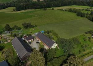 an aerial view of a house in a field at Ferienwohnung Blauregen - NEU ab März 2026 in Hohnstein