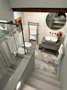 a bathroom with a sink and a toilet and a mirror at II Guelfo Bianco in Florence +78 photos