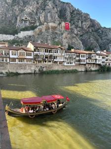 a group of people in a boat on the river at Şirince otel in Amasya
