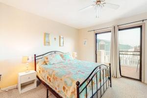 a bedroom with a bed and a large window at Nassau Village 24 in Ocean City +12 photos