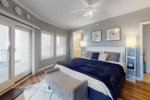 a bedroom with a large bed and a ceiling fan at Cori Noel 102 in Ocean City