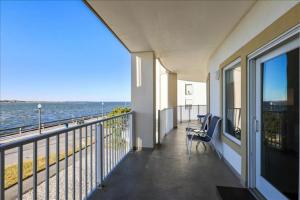a balcony of a building with a view of the ocean at Cori Noel 102 in Ocean City