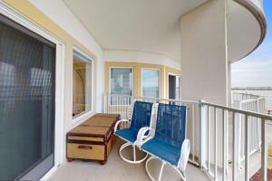 a blue bench sitting on the balcony of a house at Cori Noel 102 in Ocean City