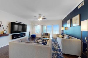 a living room with a couch and a tv at Cori Noel 102 in Ocean City +17 photos