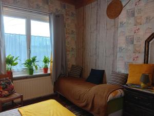 a bedroom with a bed and a window at Studio du gite in Wavrans-sur-lʼAa