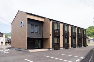 a building with a clock on the side of it at HOTEL PG3 - Vacation STAY 46492v in Habu