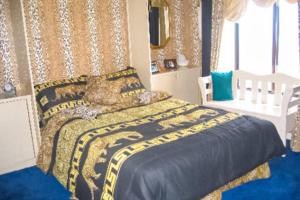 a bedroom with a bed with a blue floor at Bay Princess 103 in Ocean City