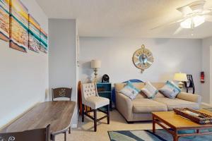 a living room with a couch and a table at Sea Nymph in Ocean City