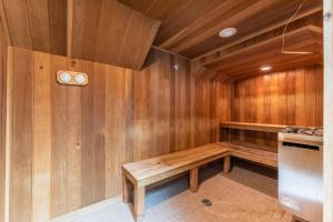 a sauna with a wooden bench in a room at Highland Greens Lodge #311 in Breckenridge