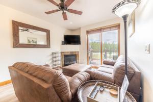 a living room with a couch and a fireplace at Highland Greens Lodge #311 in Breckenridge