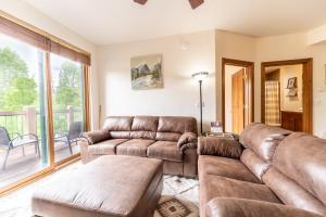 a living room with two couches and a couch at Highland Greens Lodge #311 in Breckenridge +34 photos
