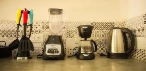 a counter top with a blender and appliances on it at Casa Foto Estudios in El Cuyo