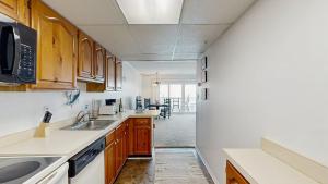 a kitchen with a sink and a counter top at White Marlin 105B in Ocean City