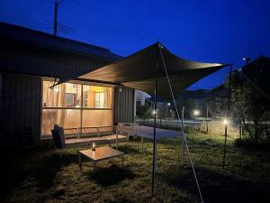 a large tent in a yard at night at TORAMIKE2 - Vacation STAY 53883v in Ichigaya