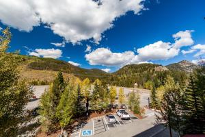 an aerial view of a parking lot with trees and mountains at Silver Mill #8222 in Keystone