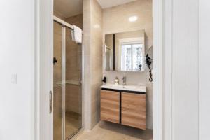 a bathroom with a sink and a shower at Alaçatı Limonaia Hotel in Alaçatı +128 photos