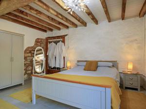 a bedroom with a bed and a mirror in it at 1 Bed in Taunton oc-87929 in Pitminster