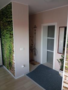 a room with a wall with a plant on it at Luxor4 in Kaštela