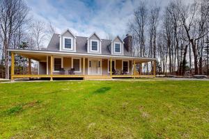 a large white house with a large grass yard at Modern Mountain Homestead in Dover