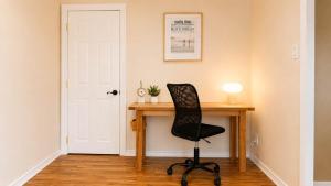 a black chair sitting at a desk in a room at Downtown 1 BR Condo near Convention Center in Seattle