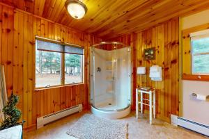 a bathroom with a shower in a wooden wall at Marlin's Way in Jay +45 photos